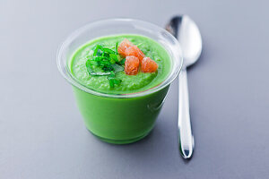 Cold cream of pea soup with pink grapefruit
