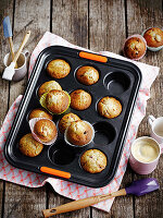 Pear and cranberry muffins in a muffin tin