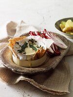 Baked camembert with thyme and bay leaves