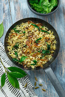 Rice fried with lentils and spinach