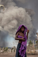 Especially the children suffer from the constant ash fall, Tavurvur Volcano, Rabaul, East New Britain, Papua New Guinea, Melanesia, Pacific