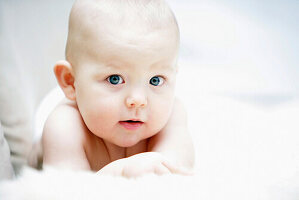 Baby lying on front, Vienna, Austria