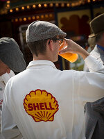 Visitor drinking, Goodwood Revival 2014, Racing Sport, Classic Car, Goodwood, Chichester, Sussex, England, Great Britain
