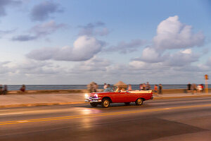 red oldtimer, cabriolet, tourists, driving along Malecon, taxi, historic town, center, old town, Habana Vieja, Habana Centro, family travel to Cuba, holiday, time-out, adventure, Havana, Cuba, Caribbean island