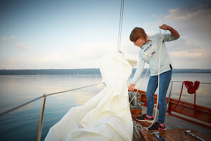 9 year old girl on the foresail of the 2 Master Sir Shackleton, Ammersee, Bavaria Germany