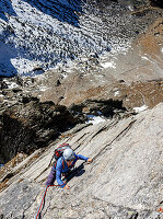Young climber climbs on a rope in granite, Gigalitz, Zillertal Alps, Tyrol, Austria