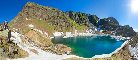 Mountain hiking in the Texel Group Nature Park, the Spronser Lakes area, the largest high-alpine lake district in Europe. The Michsee gets its name because of its location, it remains frozen until the beginning of July.