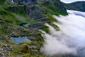 Mountain hiking in the Texel Group Nature Park in the area of the Spronser Lakes, the largest high-alpine lake district in Europe, which includes twelve lakes. In the picture the Kessel and Schiefersee.