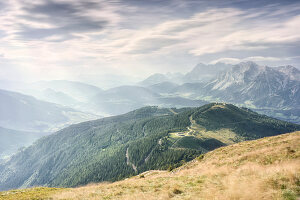 View from Krahbergzinken over the summery Planai down to Schladmin and towards the Dachstein massif, Styria, Austria.