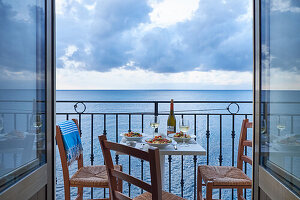 Set table on the balcony over the sea