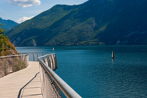 The Limone sul Garda cycle path suspended over Lake Garda gives a breathtaking spectacle to tourists. Brescia, Lombardy. Italy