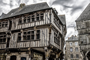 France, Brittany, Dinan, Rue de l'Apport, half-timbered house, old architecture, stormy atmosphere