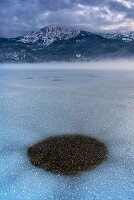 Cold winter evening on the shore of Lake Kochel, Upper Bavaria, Germany.