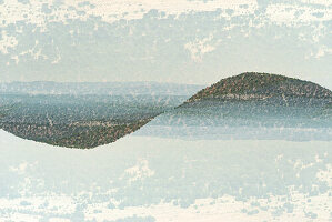 Double exposure of hills in New Mexico forming a waveform.