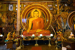 Large Buddha statue at Gangaramaya Temple, Colombo, Sri Lanka,