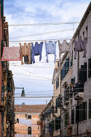  View of a house facade with shirts on a clothesline, Venice, Veneto, Italy, Europe 
