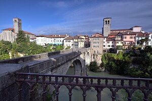  View at the Ponte Diavolo, Cividale del Friuli with tower of the Duomo on the river Natisone, Friuli, Northern Italy 