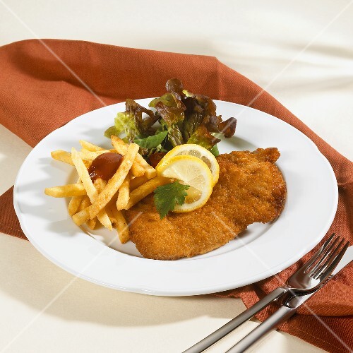 Wiener Schnitzel with chips, ketchup and … – License Images Wiener Schnitzel with chips, ketchup and … – License Images