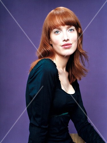 Portrait Of Redhead Woman With Medium Length Straight Hair And