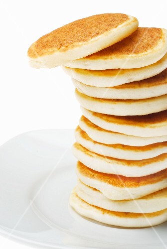 Tall Stack of Pancakes on a White Plate – License Images – StockFood ...