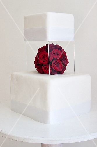 A Two Tier Wedding Cake With A Perspex License Images