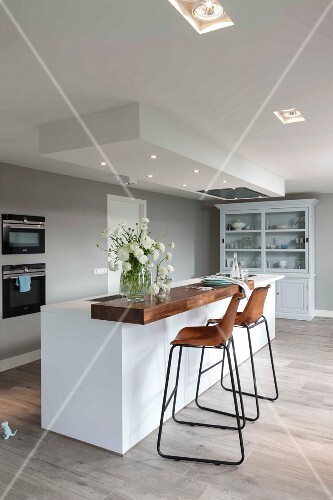 A Modern Kitchen In White With Built In Spot Lights In A