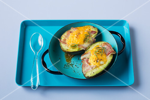 Avocado breakfast eggs with bacon (keto cuisine)