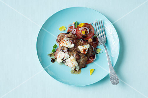 Gratinated pork escalope on tomato carpaccio (keto cuisine)