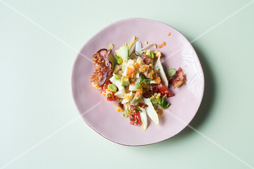 Egg salad with crispy bacon and chicory (keto cuisine)