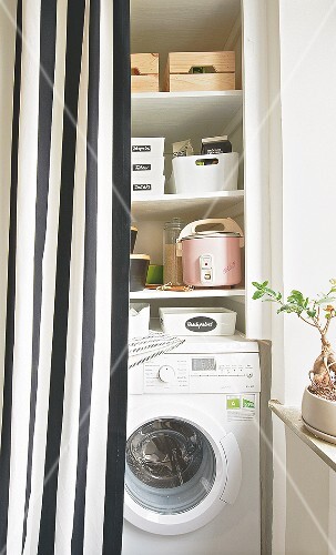 A Utility Room With Washing Machine Behind A Striped Curtain Buy
