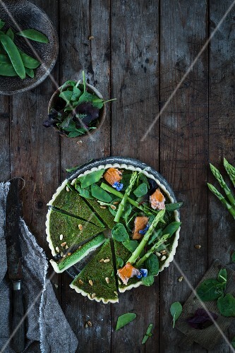 A wild garlic and asparagus tart with salmon (top view)