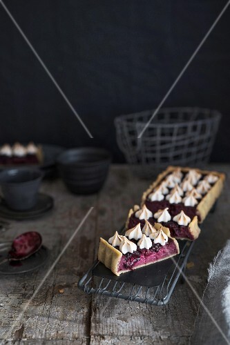 Blackberry tart with cottage cheese, on a rustic wooden table