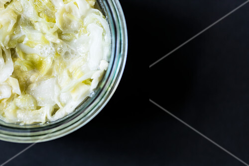 Cabbage being marinated to make sauerkraut