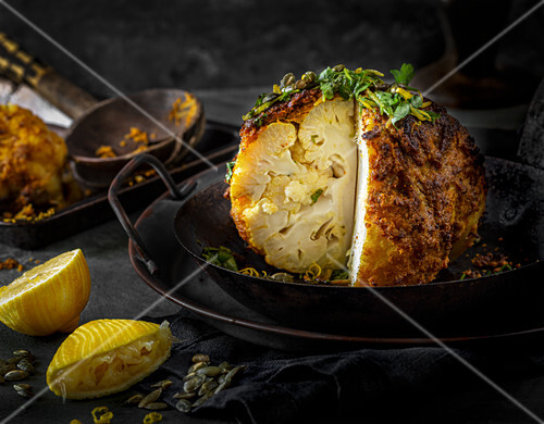 Vegan roast cauliflower with spicy crust and a lemon tahini dressing